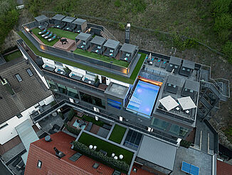 Aerial view of the roof terrace and pool at the Hotel Sternwirt in Högen